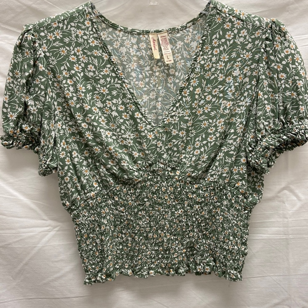 Marisol sage green smocked top with floral print.